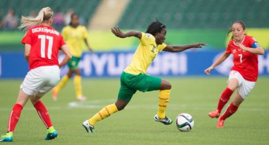 Cameroon's Francine Zouga controls the ball during the first half of their Women's World Cup group C match against Switzerland at Commonwealth Stadium in Edmonton, Canada on June 16, 2015.  By Geoff Robins AFP