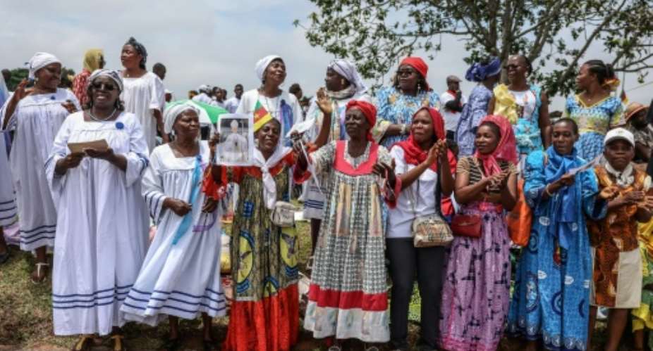 Cameroonians turned out to welcome Pope Leos arrival.  By Daniel Beloumou Olomo (AFP)