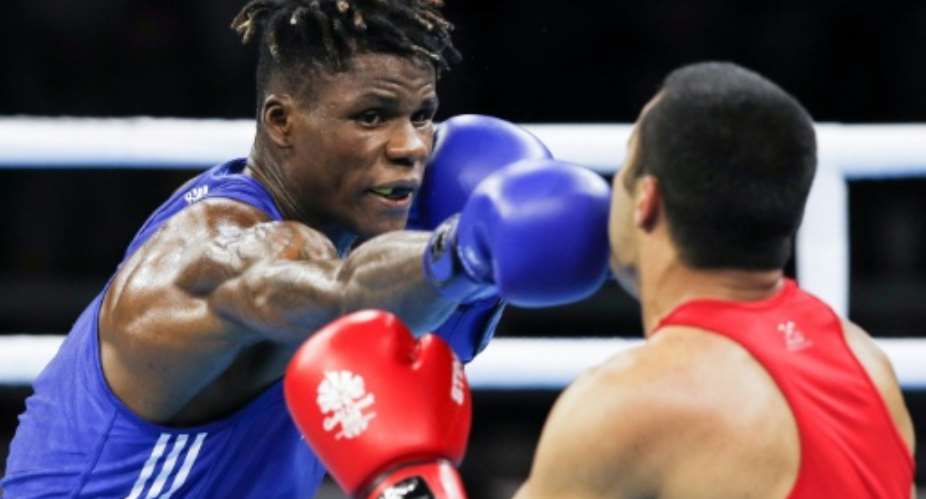 Cameroons boxer Wilfried Seyi (L),a silver medalist in the Commonwealth Games in the 75kg category, is the only one of his team who went missing while in Australia to have returned since.  By Adrian DENNIS (AFP/File)