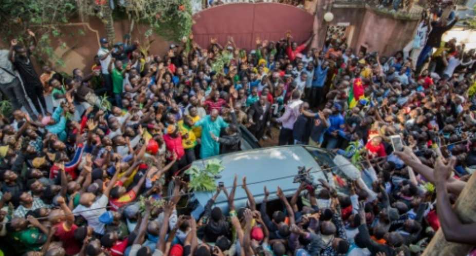 Cameroon's main opposition leader Maurice Kamto was greeted by dozens of cheering, dancing young people on his release from jail.  By STRINGER AFP