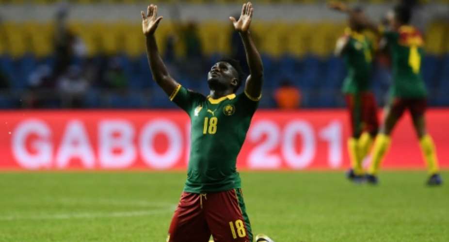 Cameroon's midfielder Robert Ndip Tambe celebrates at the end of their 2017 Africa Cup of Nations match against Guinea-Bissau at the Stade de l'Amitie Sino-Gabonaise in Libreville on January 18, 2017.  By GABRIEL BOUYS AFP