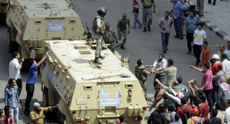 The army deployed troops in central Cairo to quell the clashes.  By  AFP