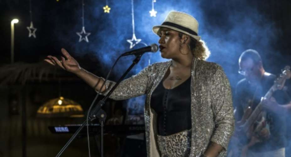 Cape Verde musician Ceuzany Pires performs during filming for the music video for her latest album, in the city of Mindelo.  By PATRICK MEINHARDT (AFP)