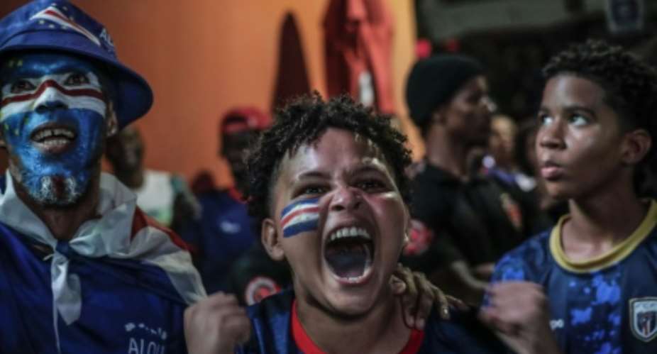 Cape Verde supporters in Praia celebrate the teams first goal against Argentina.  By JOSE CORREIA (AFP)