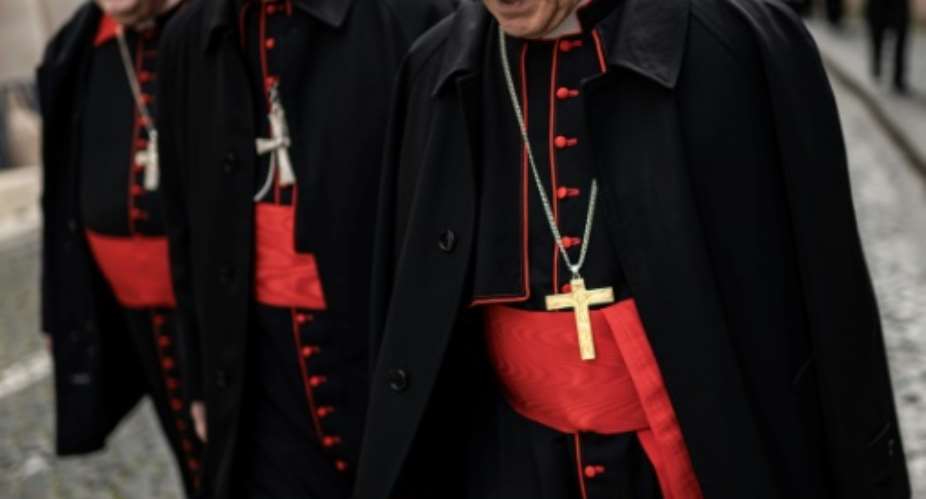 Cardinals walk near the Vatican ahead of Pope Franciss funeral.  By MARCO BERTORELLO (AFP)