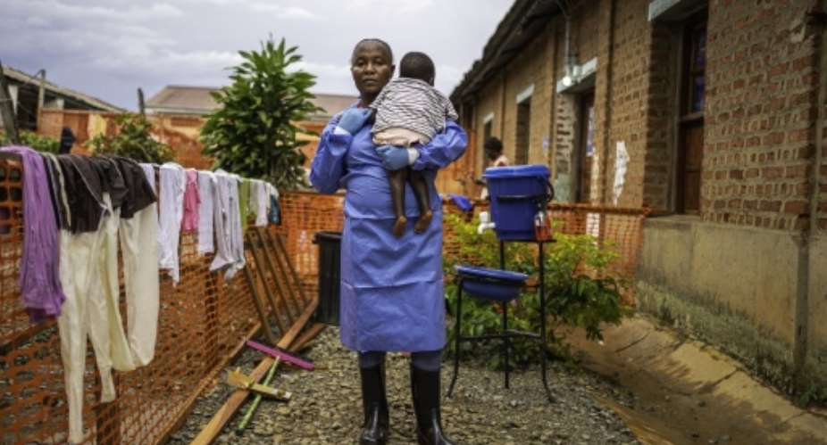 Caregiver Marie Bakikula looks after orphans of the DR Congos Ebola crisis.  By MARIE RUWET (AFP)
