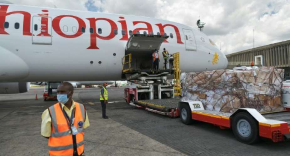 Cargo flights have helped Ethiopian Airlines remain financially viable during the coronavirus pandemic, inlcuding transporting  masks such as these donated byChinese billionaire and Alibaba co-founder Jack Ma in April.  By TONY KARUMBA AFPFile