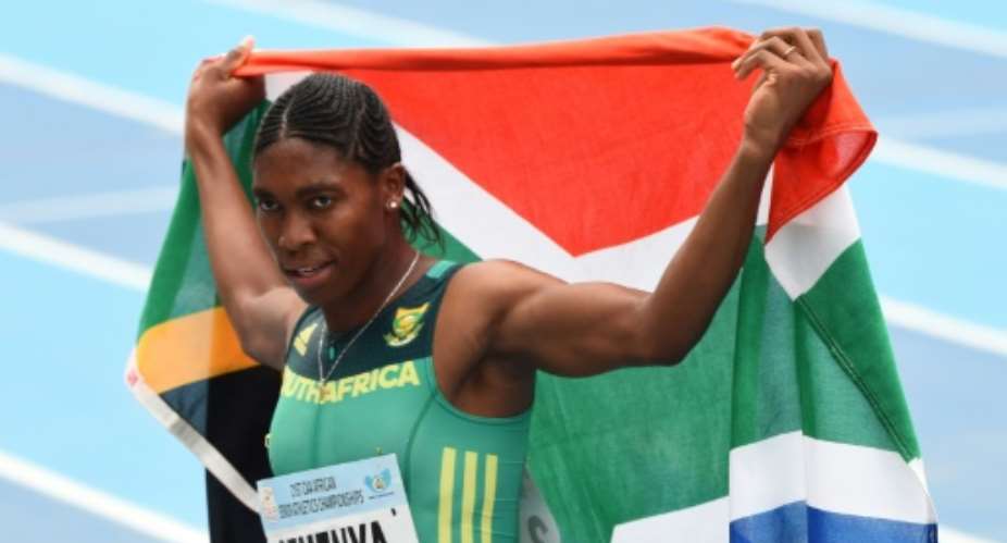 Caster Semenya celebrates with the South African flag after winning the women's 800m during the African Athletics Championships in Nigeria in August 2018.  By PIUS UTOMI EKPEI AFPFile