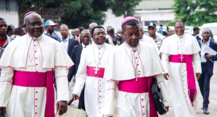 Catholic bishops arrive for the signing of an accord at the inter diocesan centre in Kinshasa on January 1, 2017 following talks launched by the Roman Catholic Church between the government and opposition.  By Junior D.Kannah AFP