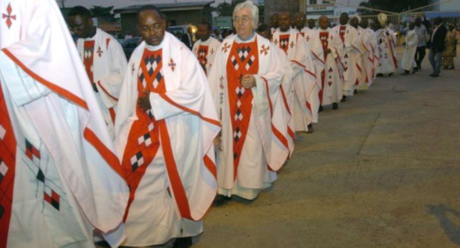 Priests and Bishops arrive at Notre Dame Cathedral in Kinshasa, on January 12, 2012.  By Junior D. Kannah AFPFile
