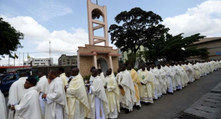 Catholic Priests walked in procession to a church in Lagos to hold a mass before proceeding on a solidarity rally against violent attacks across the country.  By PIUS UTOMI EKPEI AFP