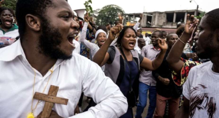Catholics were among demonstrators in Kinshasa demanding DR Congo President Kabila will not stand for re-election.  By John WESSELS AFPFile