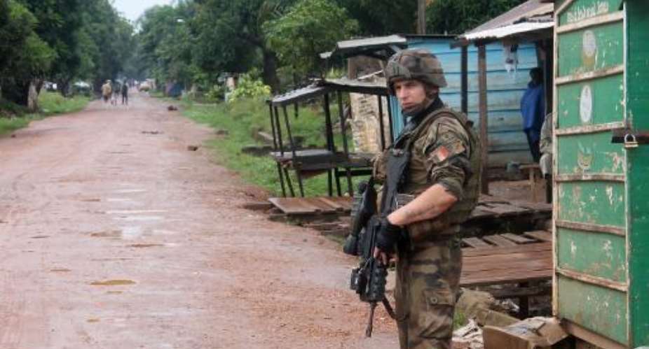 French soldiers from the European Union's Eufor mission patrol in a street of the PK5 district in Bangui on August 21, 2014.  By Pacome Pabandji AFPFile