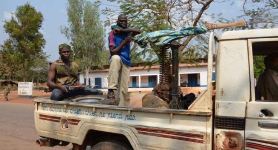 Seleka rebels on January 17, 2013 in a pickup truck, 75 kms from the capital Bangui, Central African Republic.  By Patrick Fort AFPFile