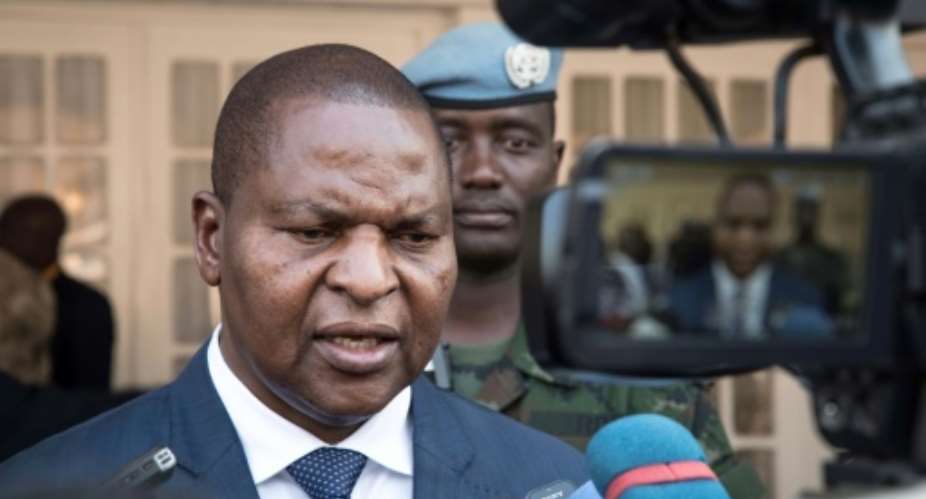 Central African Republic president Faustin-Archange Touadera signs a peace agreement reached in Khartoum earlier this month with armed groups controlling most of the country's territory.  By ASHRAF SHAZLY AFPFile