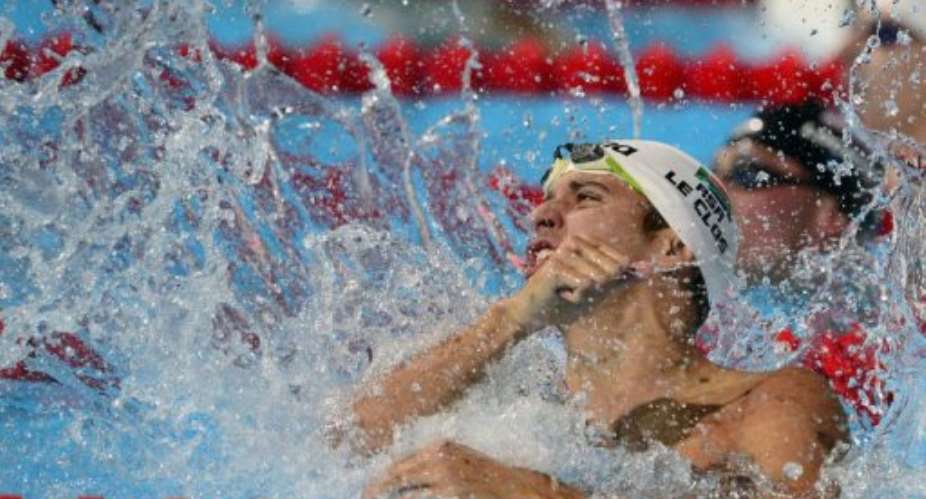 South Africa's Chad Le Clos celebrates after winning the final of the men's 100-metre butterfly, August 3, 2013.  By Lluis Gene AFP