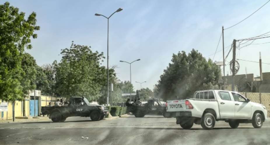 Chadian soldiers block the road leading to the headquarters of the opposition Socialist Party Without Borders' where  leader Yaya Dillo died during an army assault.  By - AFP