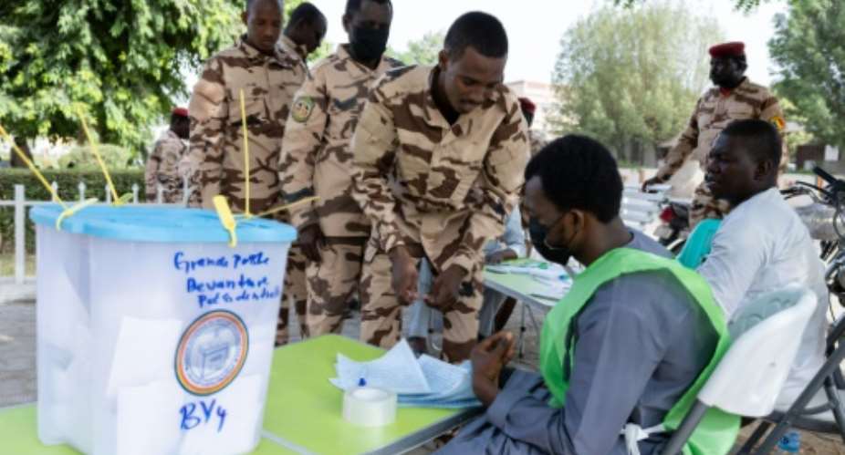 Chadian soldiers get ready to vote in an outdoor polling station in N'Djamena.  By Joris Bolomey AFP