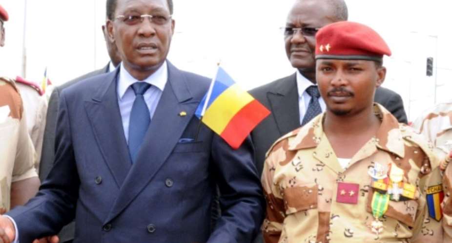 Chad's President Idriss Deby Itno pictured alongside his son Mahamat Idriss Deby in 2013.  By STR AFPFile