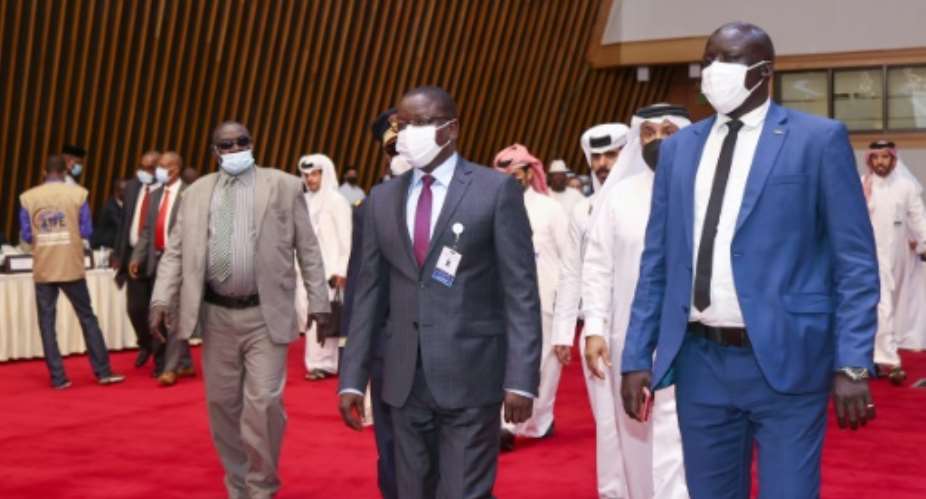 Chad's Prime Minister Albert Pahimi Padacke arrives at the start of peace talks in Doha on Sunday.  By KARIM JAAFAR AFP