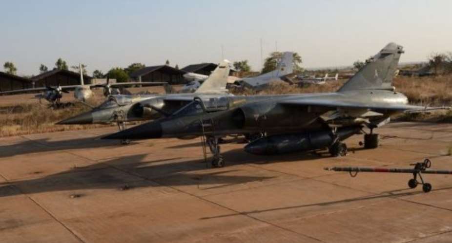 French Mirage F1 CR fighter jets are parked on the tarmac at the 101 military airbase near Bamako on January 14, 2013.  By Eric Feferberg AFP