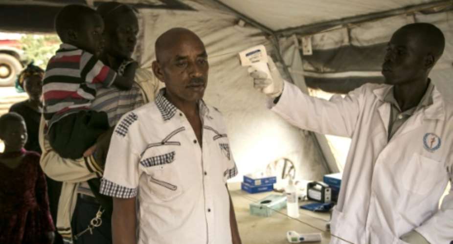 Checks on travellers at South Sudan's border with Uganda after three cases of Ebola were reported there last month. A new case has been reported just across the border in DR Congo, where an Ebola epidemic broke out last August.  By AKUOT CHOL AFP