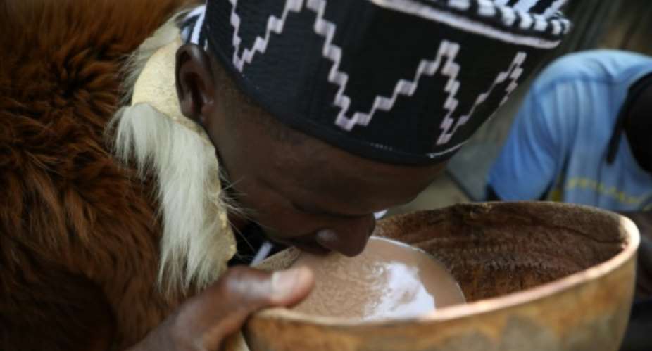 Cheers: Burukutu has been brewed for generations by the Jukun people of central and northern Nigeria.  By Kola Sulaimon AFP