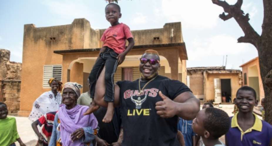 Cheick Ahmed Al-Hassan Sanou aka Iron Biby weighs 180 kilogrammes (400 pounds) and is 1.9 metres (six feet and two inches) tall.  By OLYMPIA DE MAISMONT (AFP)