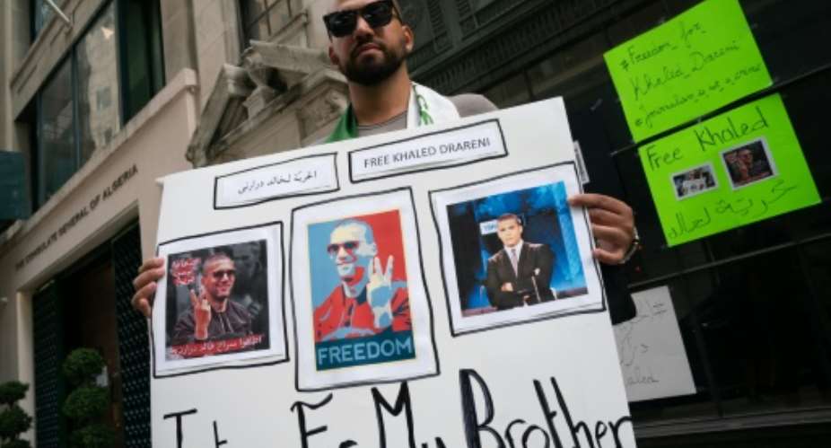 Chekib Drareni is seen outside the Algerian consulate in New York protesting Algeria's jailing of his brother, journalist Khaled Drareni.  By Bryan R. Smith AFP