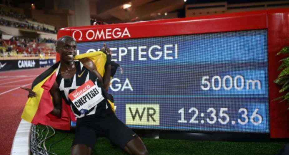 Cheptegei with his world record time.  By Matthias Hangst POOLAFP
