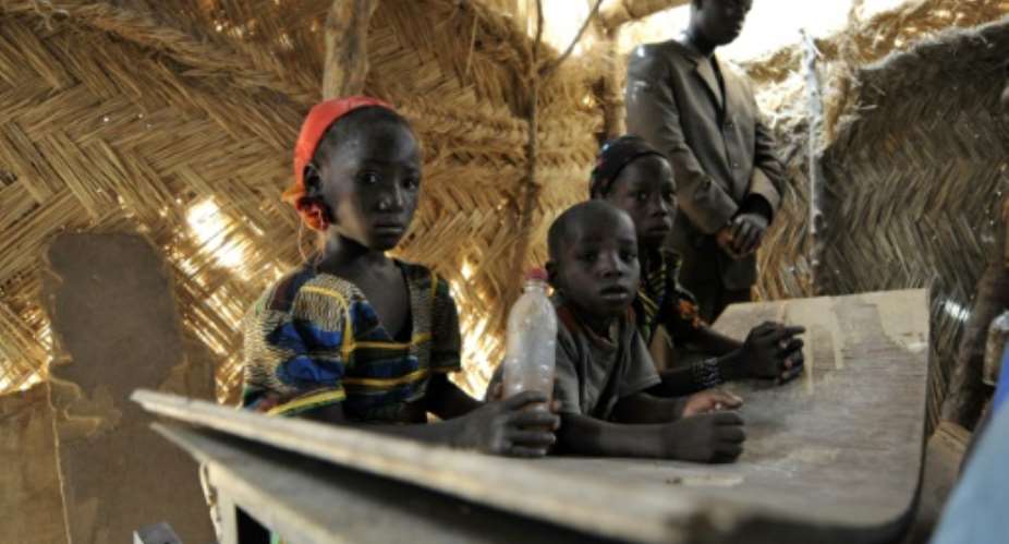 Children at a primary school in Kongome, Niger, a drought-stricken region where disruption from jihadist violence is common and food shortage is rampant, in April 2010.  By SIA KAMBOU (AFP/File)