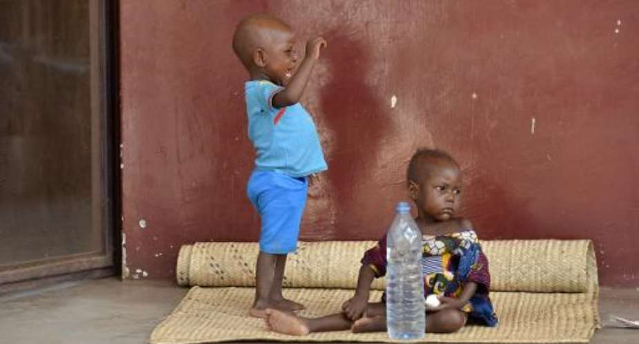 Children who suffer from nutritional problems are pictured at the therapeutical nutritional unit of the pedriatic hospital in Bangui on December 30, 2013.  By Miguel Medina AFP