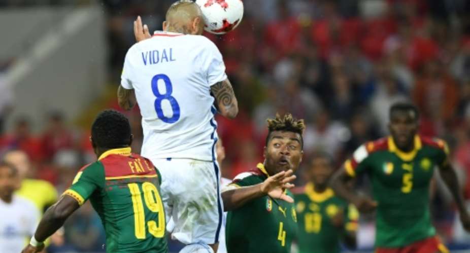 Chile's midfielder Arturo Vidal C scores a header against Cameroon on June 18, 2017.  By Yuri KADOBNOV AFP