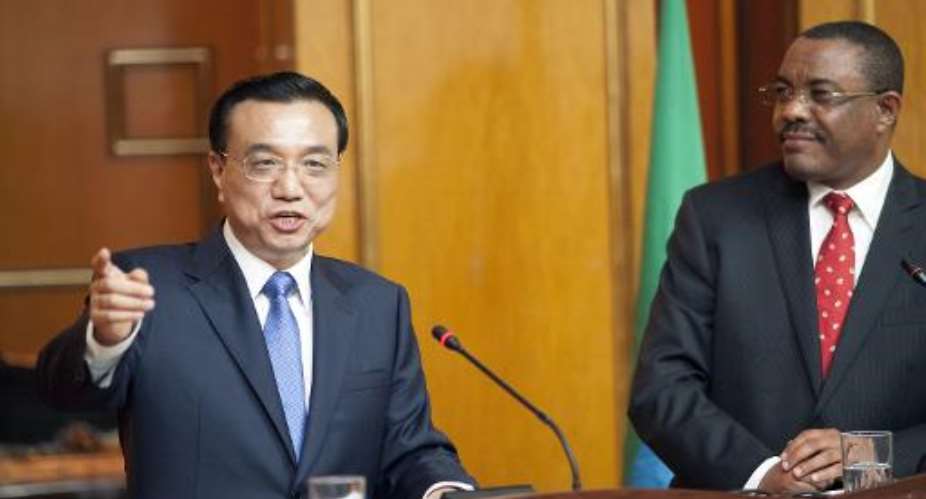 Chinese Prime Minister Li Keqiang L and his Ethiopian counterpart Hailemariam Desalegn R deliver a joint press statement during a treaty signing ceremony at the presidential palace in Addis Ababa on May 4, 2014.  By Zacharias Abubeker AFPFile