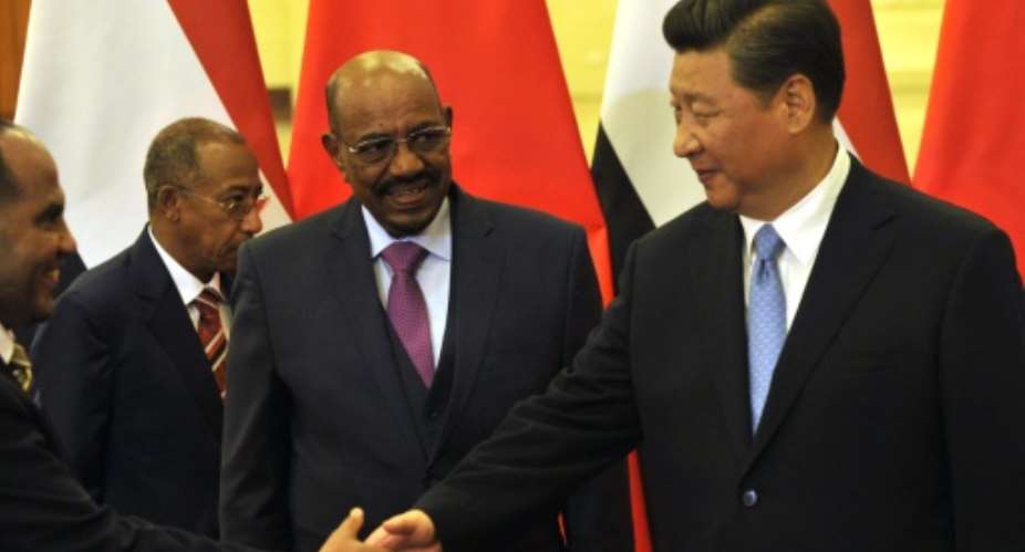 Sudanese President Omar al-Bashir C pictured with Chinese President Xi Jinping before their meeting at the Great Hall of the People in Beijing on September 1, 2015.  By Parker Song PoolAFP