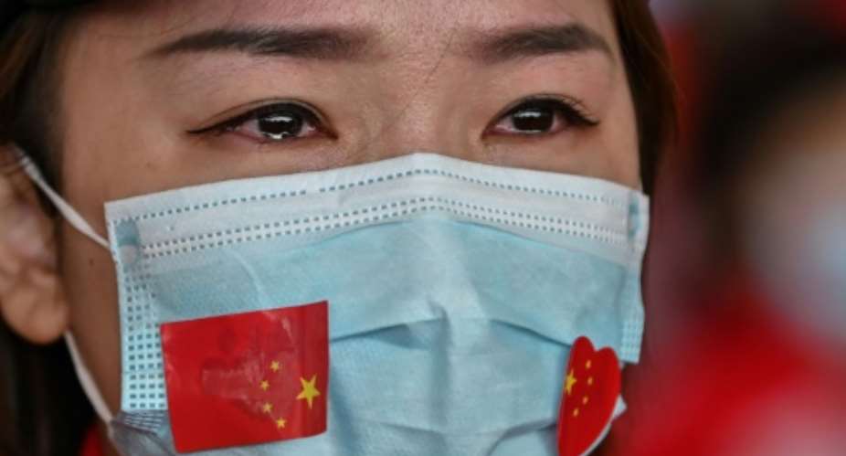 Chinese medical staff volunteers began to leave Wuhan after the airport reopened following the end to a travel ban.  By Hector RETAMAL AFP