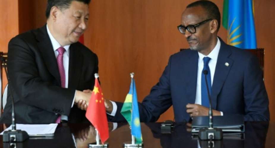 Chinese President Xi Jinping and Rwandan President Paul Kagame spoke with the press on Monday..  By SIMON MAINA AFP