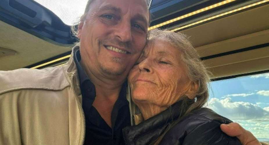 Christoph Gretzmacher released a photograph of him with his mother Eva Gretzmacher on her return to Vienna after her release.  By CHRISTOPH GRETZMACHER (APA/AFP)