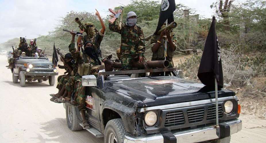 Militants belonging to Somalias Al-Qaeda-inspired Shebab Islamists ride vehicles and display weapons and flags in 2010.  By  AFPFile