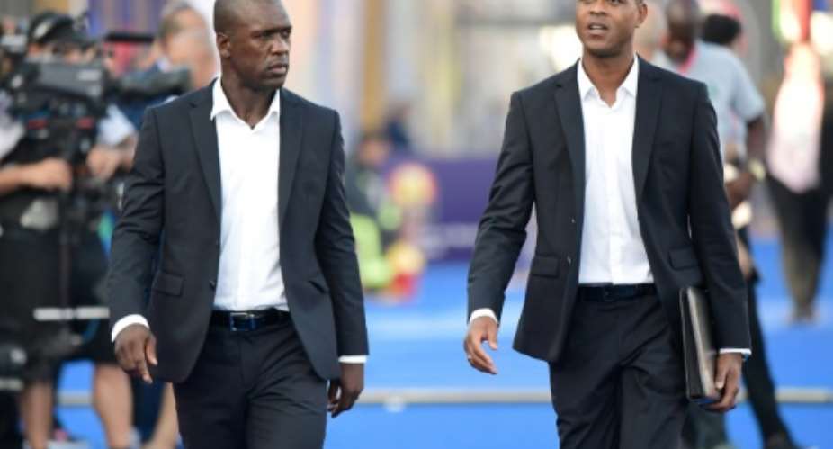 Clarence Seedorf and his assistant Patrick Kluivert arrive for the match against Nigeria in Africa Cup of Nations round of 16, their last in charge of Cameroon.  By JAVIER SORIANO AFPFile