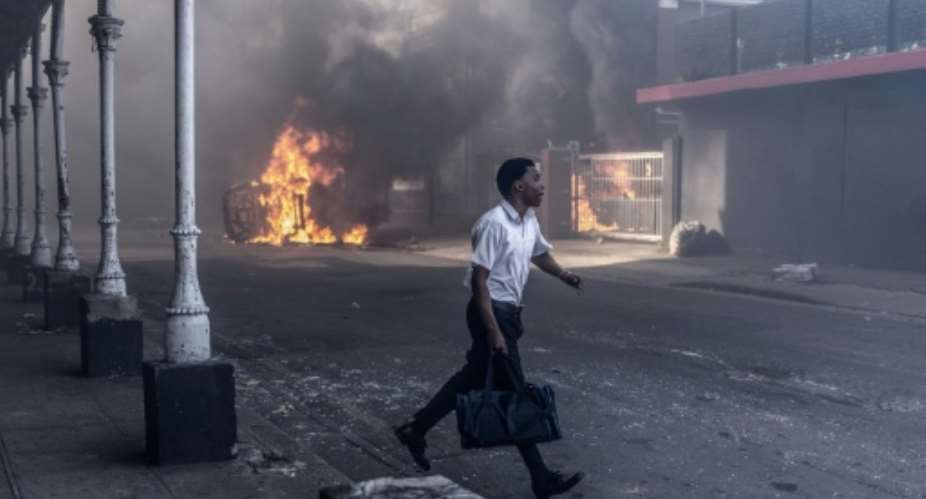 Clashes erupted between protesters and foreign nationals in Durban and Johannesburg.  By RAJESH JANTILAL (AFP)