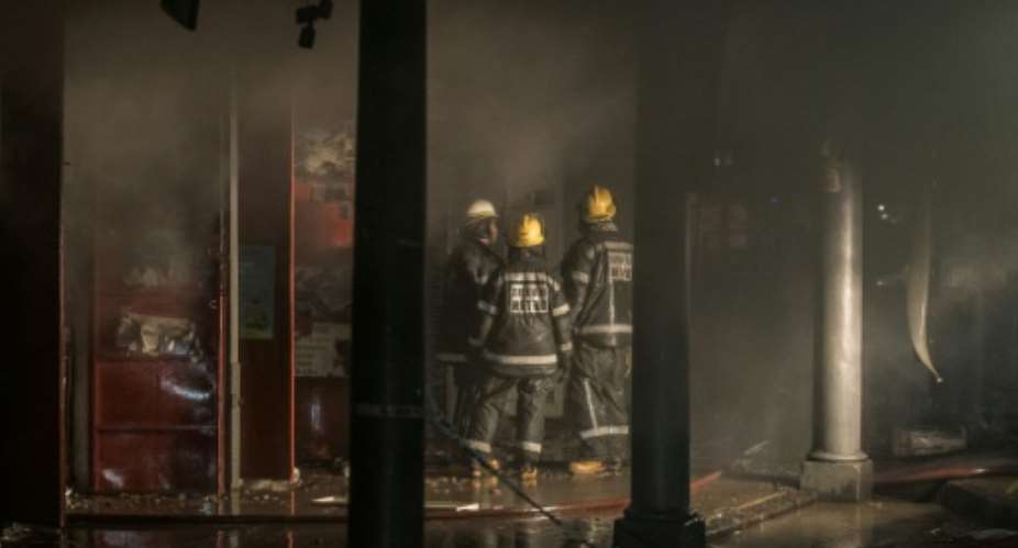Clashes erupted in Johannesburg and Durban, where a building was set on fire.  By MARCO LONGARI (AFP)
