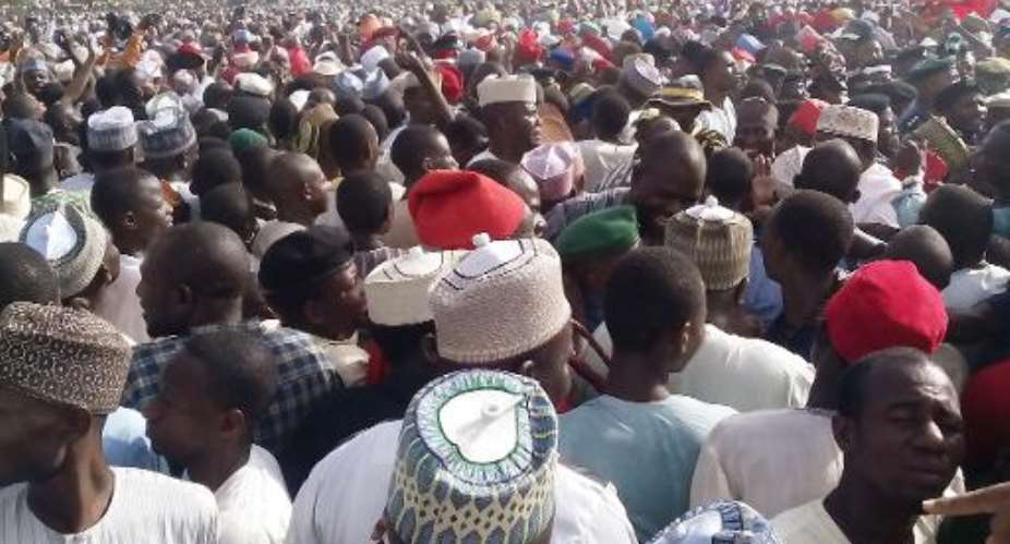 A mammoth crowd gather outside the royal palace in the northern Nigerian city of Kano for the funeral of Ado Abdullahi Bayero, the late Emir of Kano, on June 6, 2014.  By Aminu Abubakar (AFP/File)