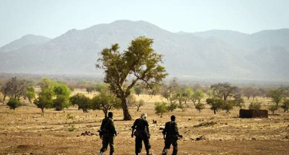 Sudan People's Liberation Army North soldiers walk in Mufalu, South Kordofan state, Sudan on April 6, 2012.  By  AFPFile