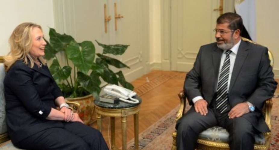Egyptian President Mohamed Morsi R meets US Secretary of State Hillary Clinton.  By Khaled Desouki AFP