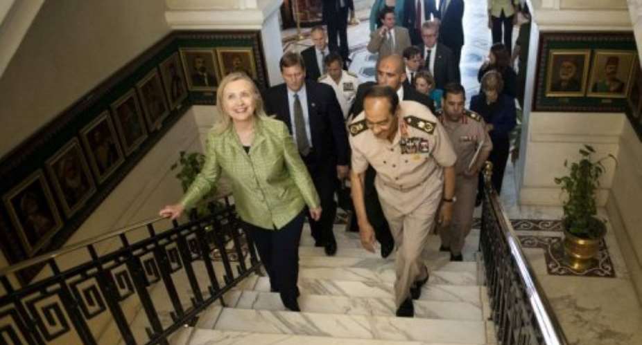 Field Marshal Mohamed Tantawi walks with US Secretary of State Hillary Clinton.  By Brendan Smialowski (AFP/Pool)