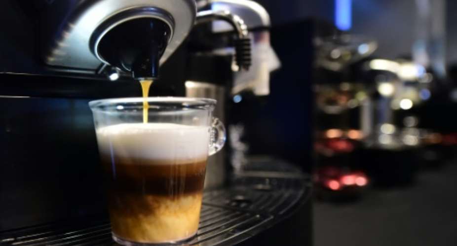 A triple-layered espresso from Nespresso's Gemini CS200 pro coffee machine is prepared on September 30, 2015.  By Frederic J. Brown AFPFile