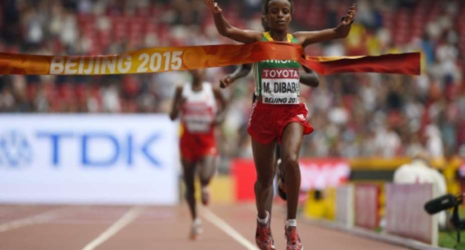 Ethiopia's Mare Dibaba wins the final of the women's marathon athletics event at the 2015 IAAF World Championships at the Bird's Nest National Stadium in Beijing on August 30, 2015.  By Olivier Morin AFP