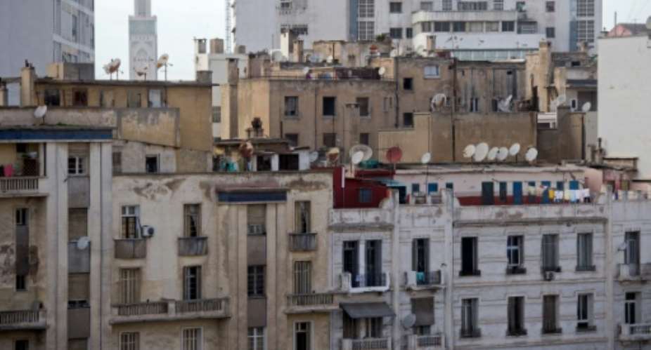 Clotheslines, satellite dishes and tangled cables have sprouted on the deteriorating facades of central Casablanca's buildings, constructed nearly a century ago under French rule.  By Fadel Senna AFP