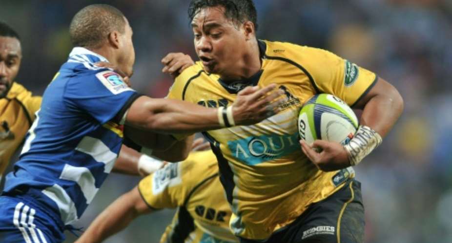 Ita Vaea of the ACT Brumbies R is being tackled by Juan de Jongh of the Western Stormers during their Super Rugby match in Cape Town, South Africa.  By Luigi Bennett AFPFile